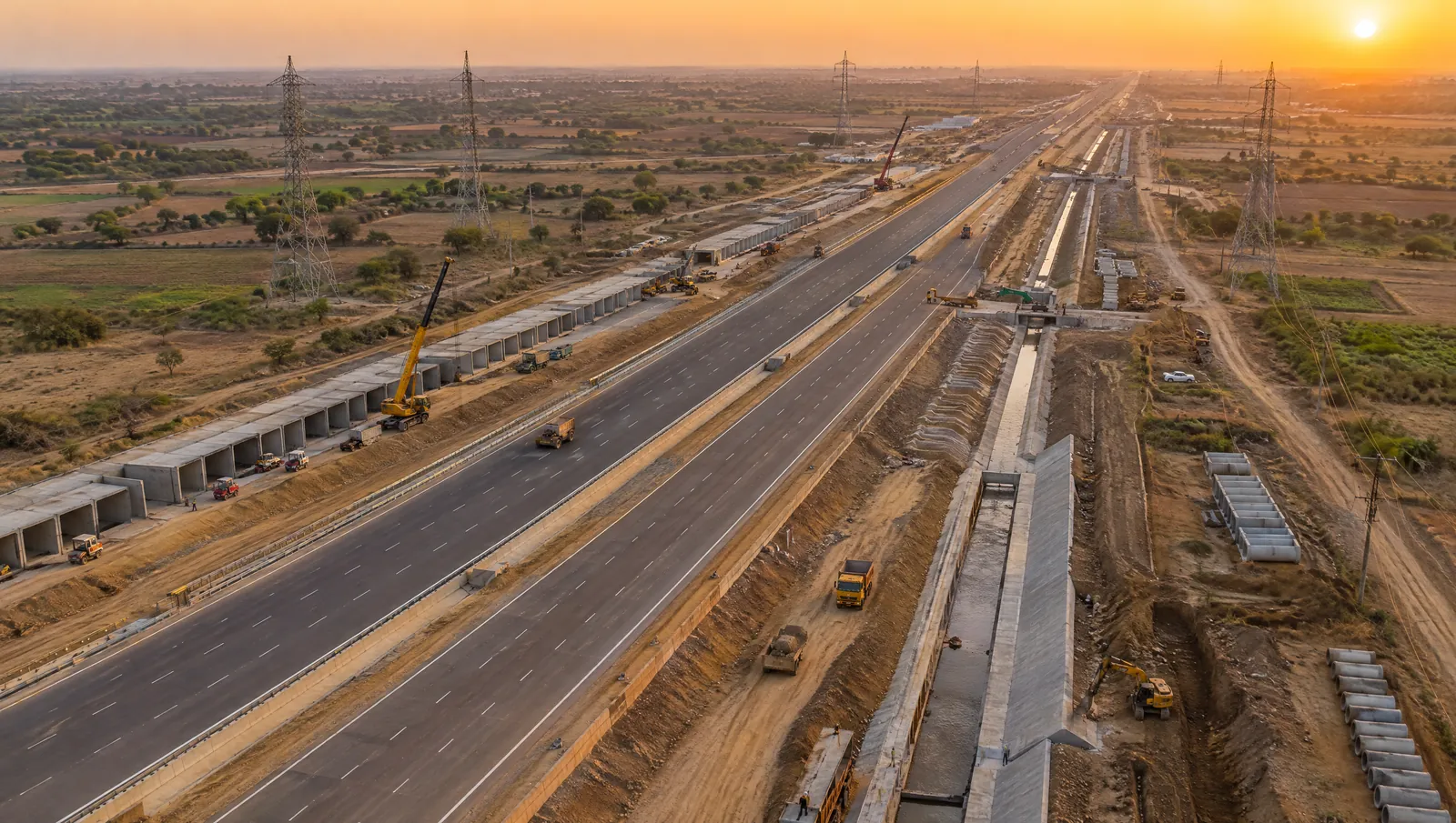 Illustration of a wide expressway under construction, seen from above, running straight across flat land
